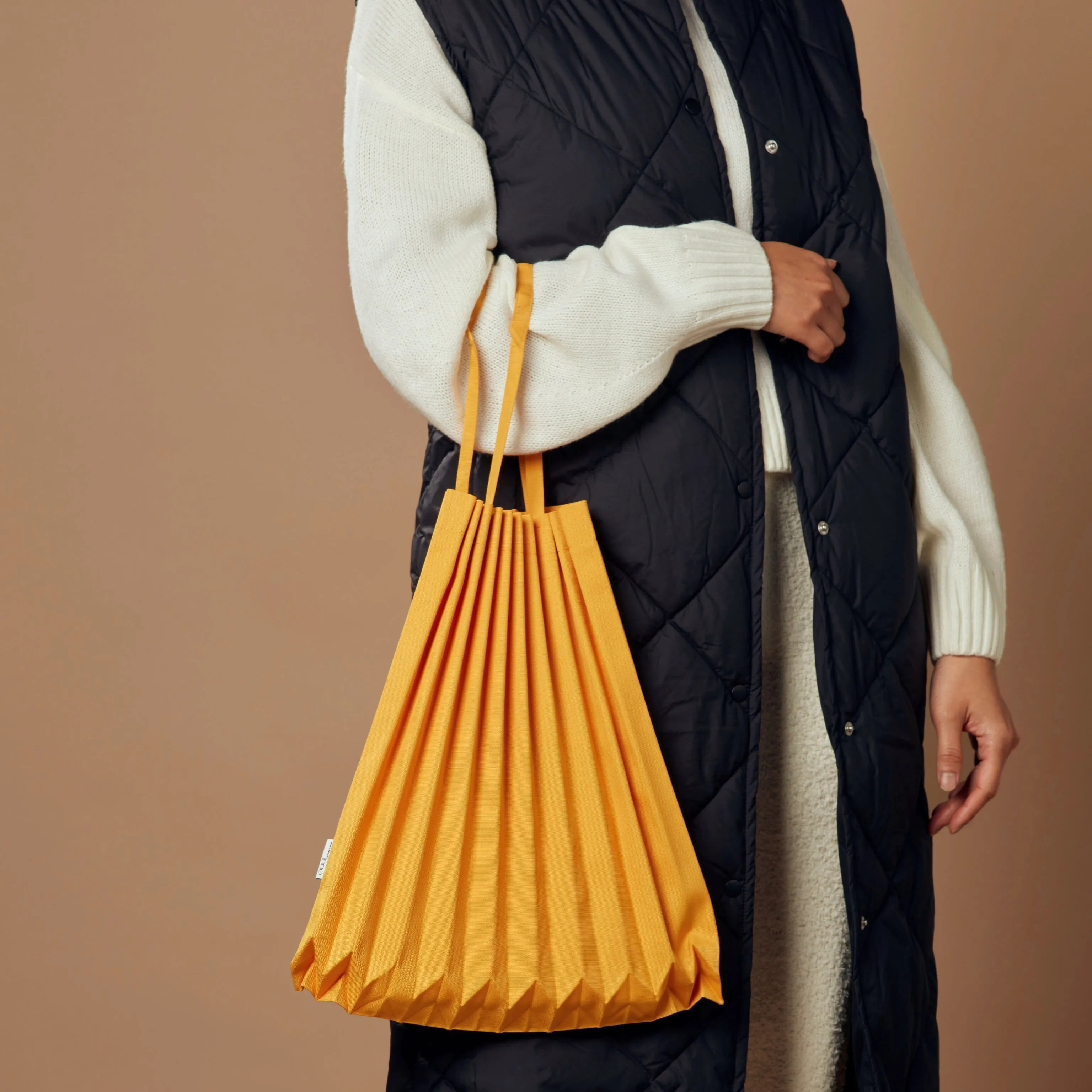 me ISSEY MIYAKE Recycled Polyester Trunk Pleats Bag - Marigold